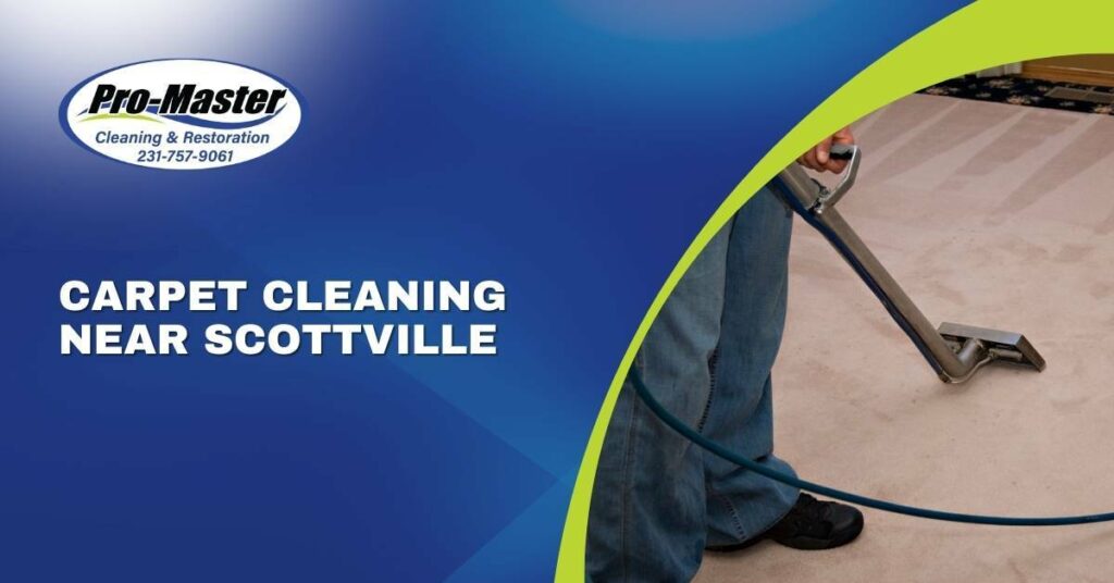 A Professional Carpet Cleaner Holding a Vacuum Cleaning a Beige Carpet | Carpet Cleaning Near Scottville, MI | Pro-Master Cleaning & Restoration