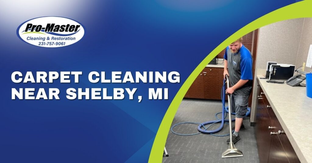 Promotional graphic for Pro-Master Cleaning & Restoration, advertising carpet cleaning services near Shelby, MI. The left side features a blue background with the company logo, phone number (231-757-9061), and bold white text reading 'CARPET CLEANING NEAR SHELBY, MI.' The right side shows a photo of a man cleaning a light grey patterned carpet in an office setting, using a silver carpet cleaning wand connected to a blue hose. A vibrant lime green curved stripe separates the text and photo, adding a modern touch.